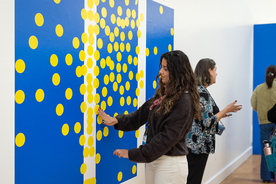 Attendee interacting with an AI-generated photo display