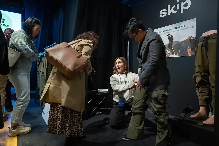 People testing wearable gear at a tech event.